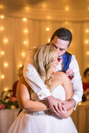 Gledswood Wedding - groom hugs the bride as they dance