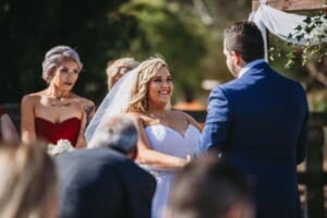 Gledswood Wedding - bride and groom hold hands during the ceremony