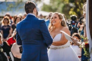 Gledswood Wedding - bride and groom hold hands during the ceremony