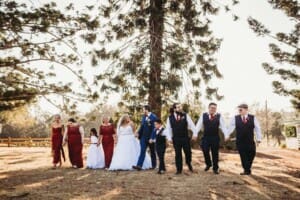Gledswood Wedding - bridal party walk across the venue gardens