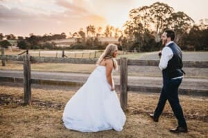 Gledswood Wedding - bride and groom admire the sunset before the reception