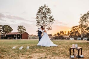 Gledswood Wedding - bride and groom play lawn games at sunset