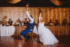 Gledswood Wedding - bride and groom play the shoe game
