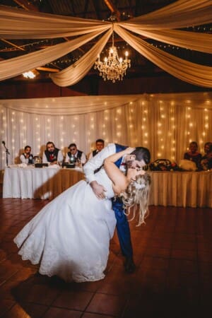 Gledswood Wedding - groom dips his bride as they dance