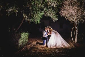 Gledswood Wedding - bride and groom at night in the venue gardens