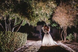 Gledswood Wedding - bride and groom at night in the venue gardens
