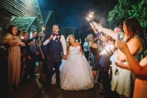 Gledswood Wedding - bride and groom sparkler exit from the venue