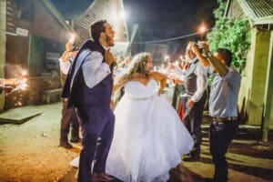 Gledswood Wedding - bride and groom sparkler exit from the venue