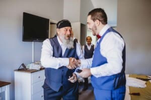 Gledswood Wedding - groom exchanges gifts with the brides father