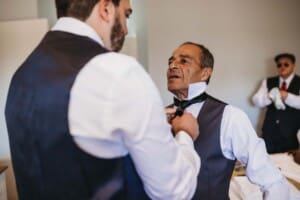 Gledswood Wedding - groom helps his father with the tie