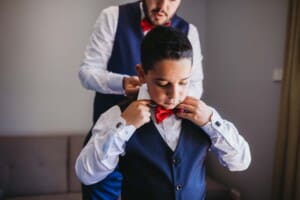 Gledswood Wedding - groom helps the pageboy with his tie
