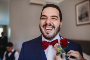 Gledswood Wedding - groom gets his button flower adjusted