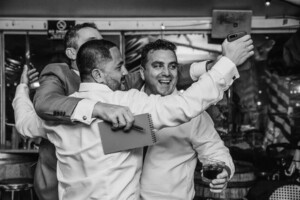 Sydney Wedding Photographer - Groomsmen hugging after the wedding