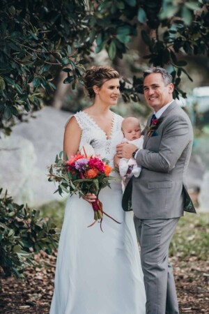 Sydney wedding photographer - bride and groom with their baby flower girl