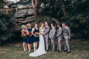 Sydney wedding photographer - Bridal party making the bride and groom laugh