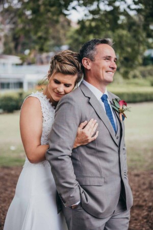 Sydney wedding photographer - A bride hugging her groom
