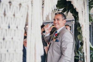 Sydney wedding photographer - Groom enjoying a glass of bubbly at the wedding