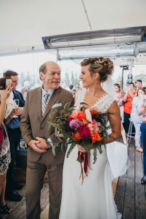 Sydney wedding photographer - Bride and her dad walking down the aisle