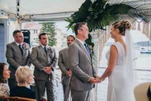 Sydney wedding photographer - bride and groom hold hands at the ceremony