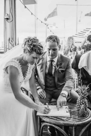 Sydney Wedding Photographer - bride signs the marriage certificate