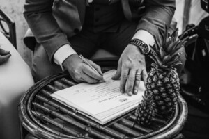 Sydney Wedding Photographer - The groom signing the marriage certificate