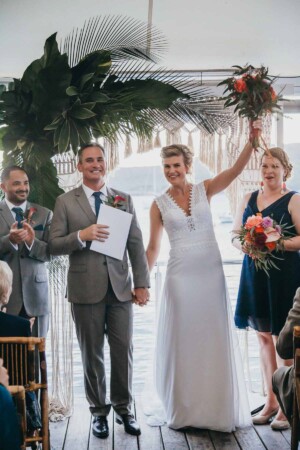Sydney Wedding Photographer - Bride and groom cheer after getting married