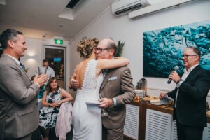 Sydney Wedding Photographer - Bride hugs her dad during the speeches