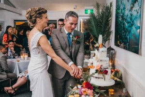 Sydney Wedding Photographer - Bride and groom cut the wedding cake