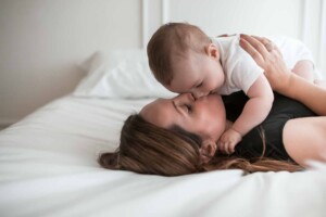 A baby boy giving his mummy a big sloppy kiss