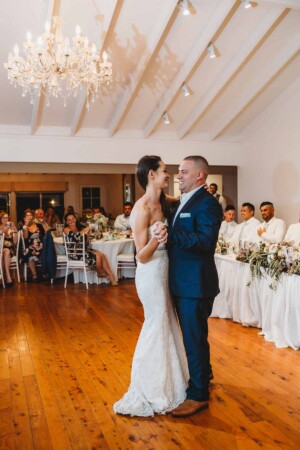 The bridal & groom share a first wedding dance