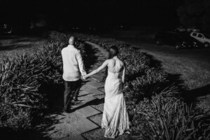 Bride & groom exit the wedding reception