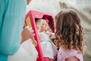 Chapel Hill Wedding - Flower girl looking at her bridal doll