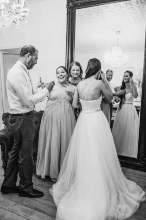 Chapel Hill Wedding - Bridesmaids helping the bride get ready