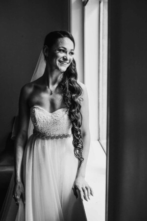 Chapel Hill Wedding - bride looking out the window smiling