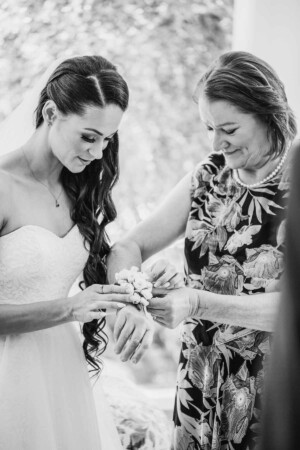 Chapel Hill Wedding - A bride fitting her mum's corsage