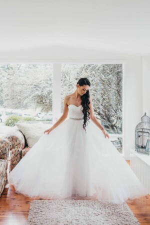 Chapel Hill Wedding - bride fluffing her bridal gown