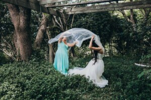 Chapel Hill Wedding - bride and bridesmaid play with the veil