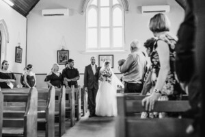 A father walking the bride down the aisle