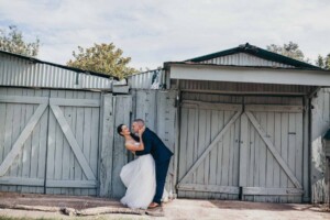 Groom leans in to kiss his new bride