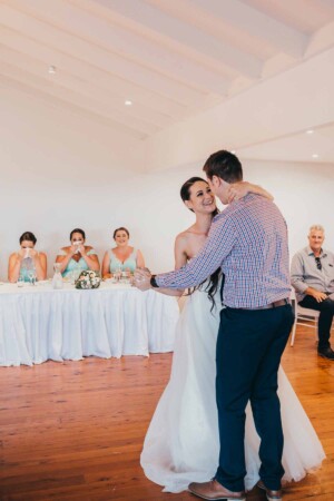 Bride dances with her brother at the reception