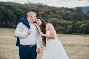 A couple kiss on their wedding day at Chapel Hill