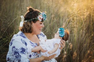 A mother admiring her newborn baby girls face