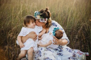 A mother holds her daughters