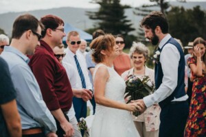 A groom greets his bride on their wedding day
