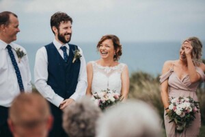 A bride laughing during the wedding ceremony