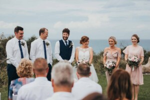 A bride laughing with the bridal party
