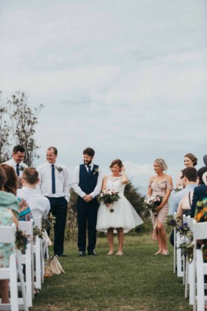 A bride & groom in the wedding aisle