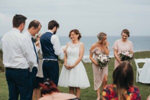 A bride laughing at her partners wedding vows