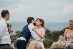 A bride & groom share their first kiss