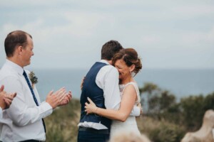 A bride & groom embrace during the wedding